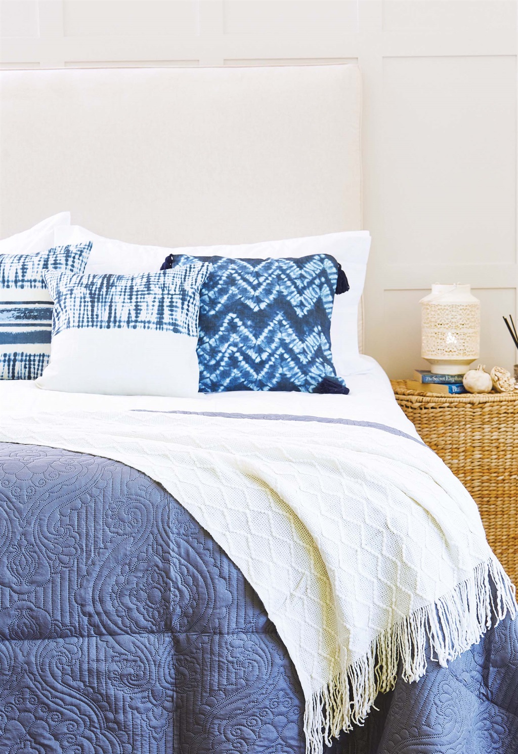 GET THE LOOK - White, neutrals and calming blues create the perfect bedroom retreat. The use of different textures and materials adds interest and warmth. The tie-dye printed scatter covers (45 x 45cm; R120 each) come in three designs.