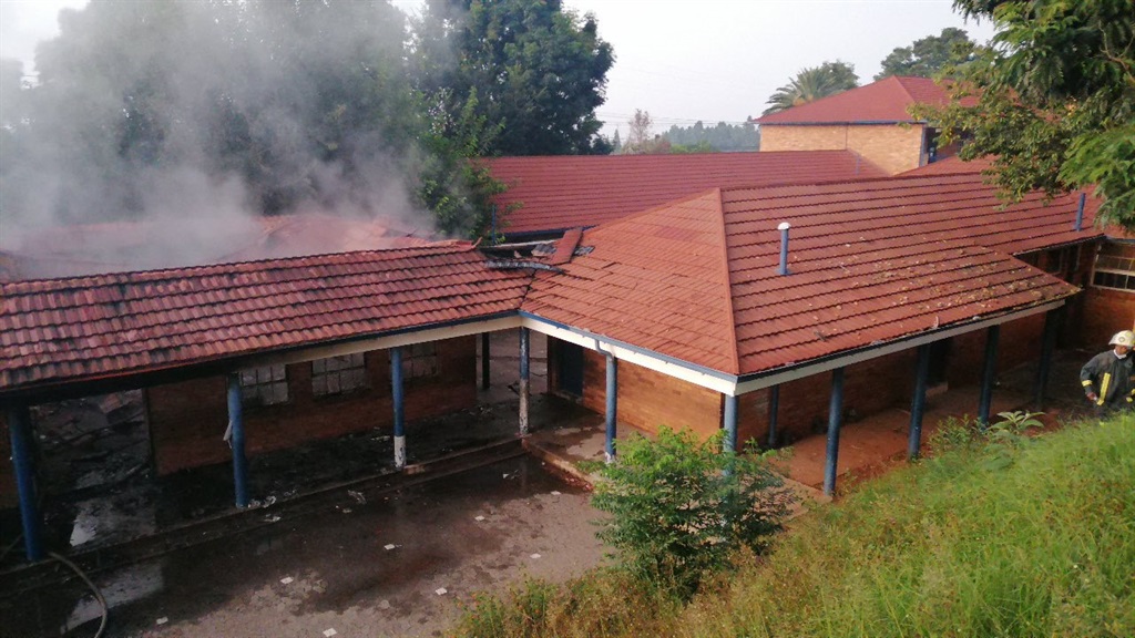 The classrooms were burning, smoke billowing outside