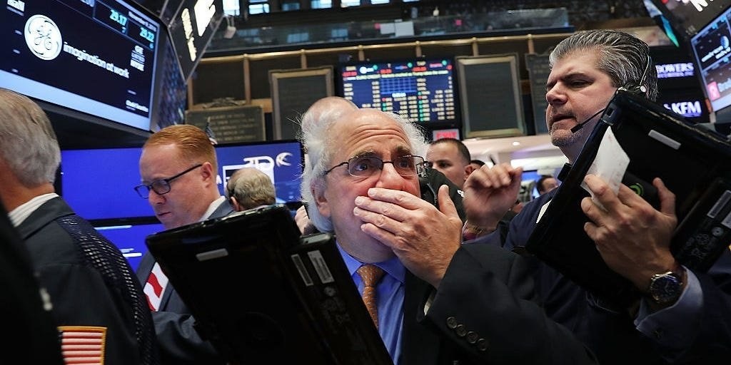 Traders work on the floor of the New York Stock Ex