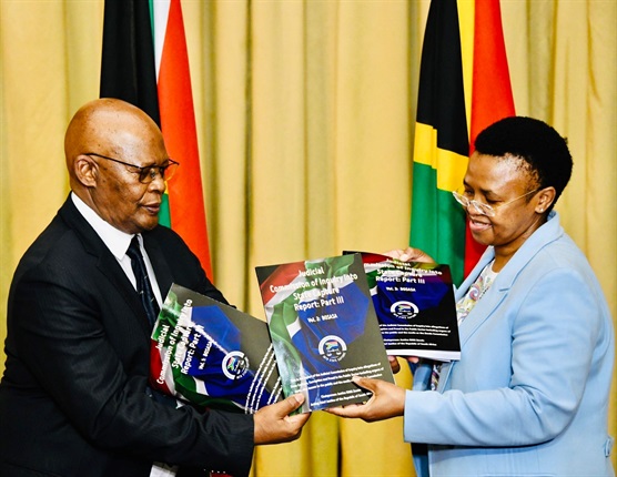 Presidency Director-General Ms Phindile Baleni receiving a third volume of the report of the Judicial Commission of Inquiry into Allegations of State Capture, Corruption and Fraud in the Public Sector on behalf of the President, presented by the Secretary of the Commission, Prof Itumeleng Mosala at the Union Buildings. South Africa. 01/03/2022. (Siyabulela Duda)
