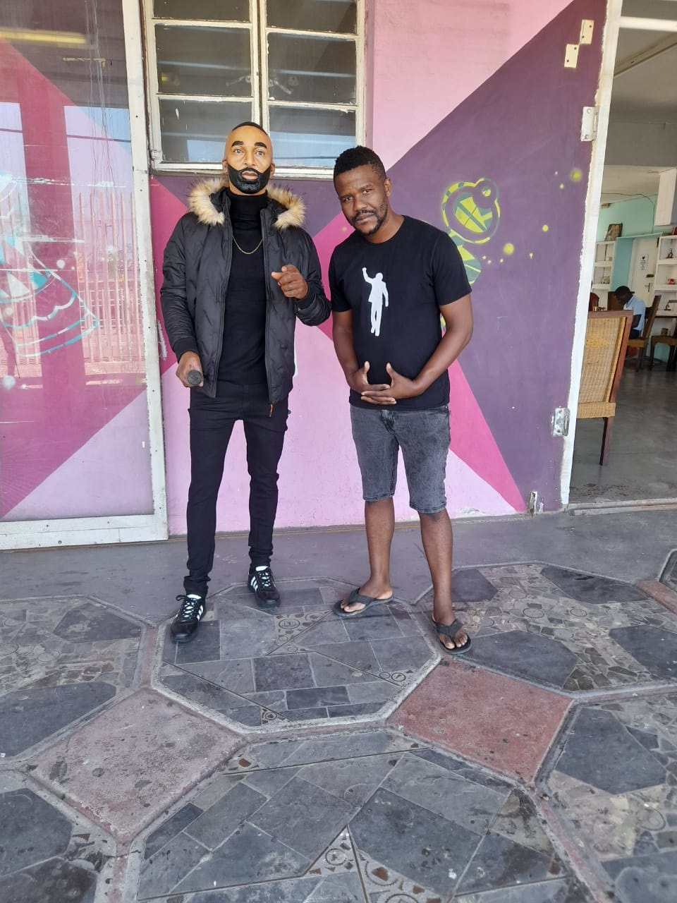  Artist Lungelo Gumede standing next to Ricky Rick's wax. Photo supplied.