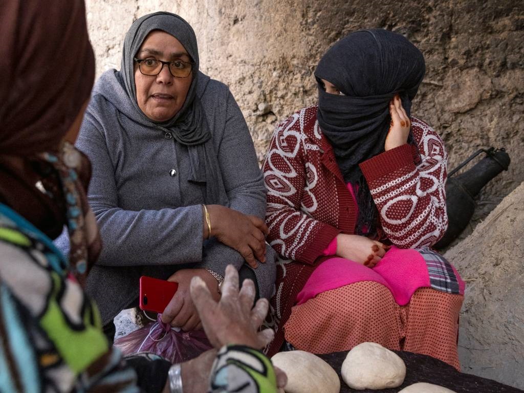 A member of a Women's rights group meets with women in the village of Tamarwoute, a remote part of the North African kingdom's Anti-Atlas mountains.