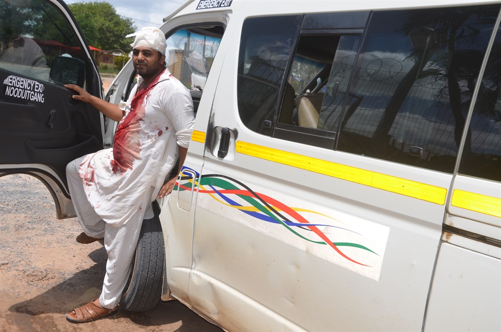 Bleeding Pakistani national after being shot at and robbed by Tsotsis inside this Quantum taxi