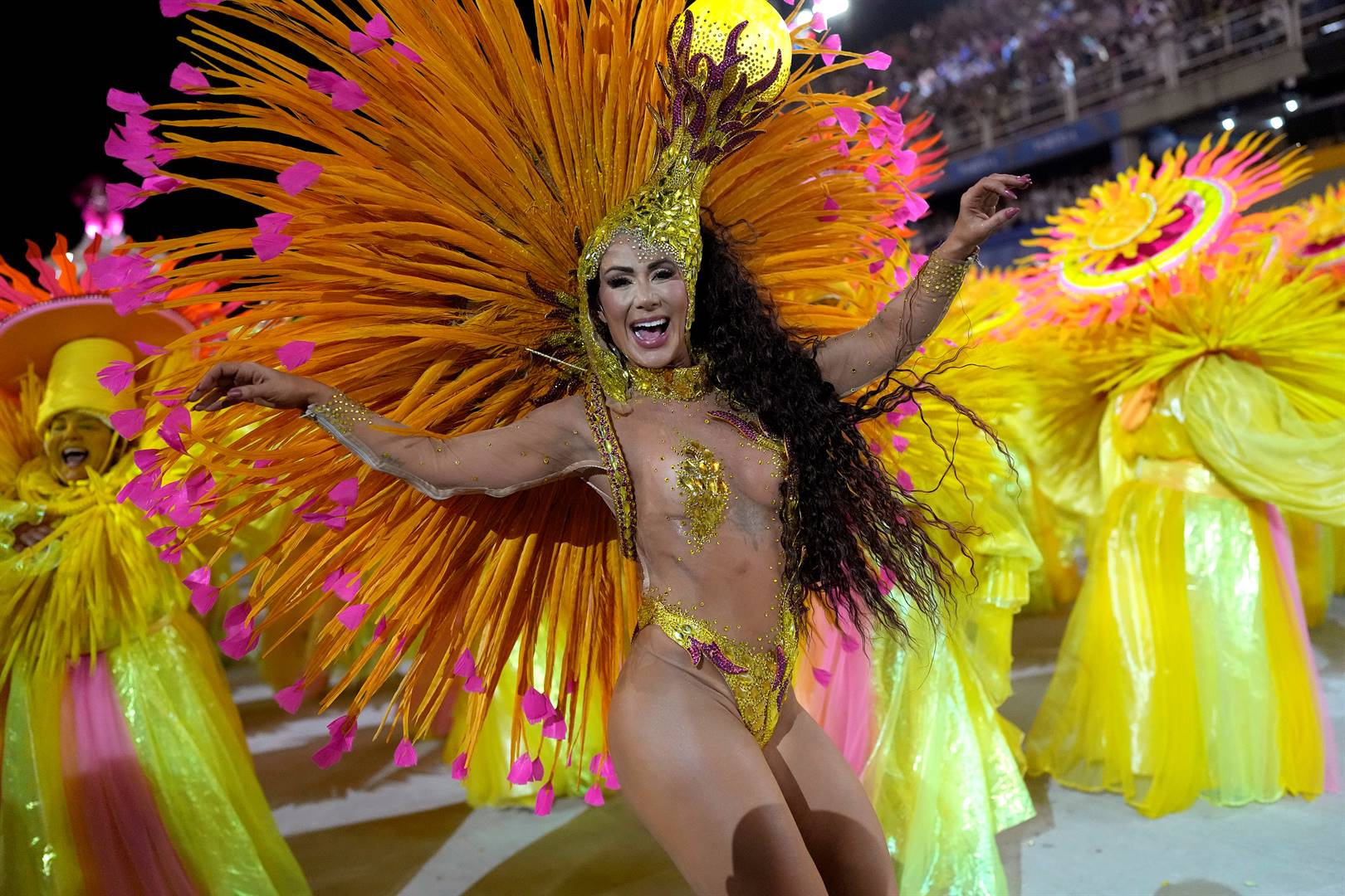 A Mangueira samba school performer parades during the Rio carnival celebrations at the Sambadrome in Rio de Janeiro, Brazil on Friday. Photo: Silvia Izquierdo/AP