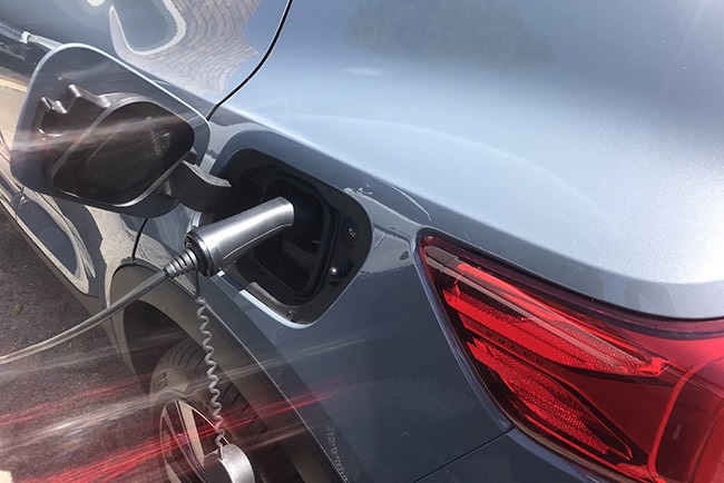 The Volvo XC 40 P6 Recharge plugged in and charging.