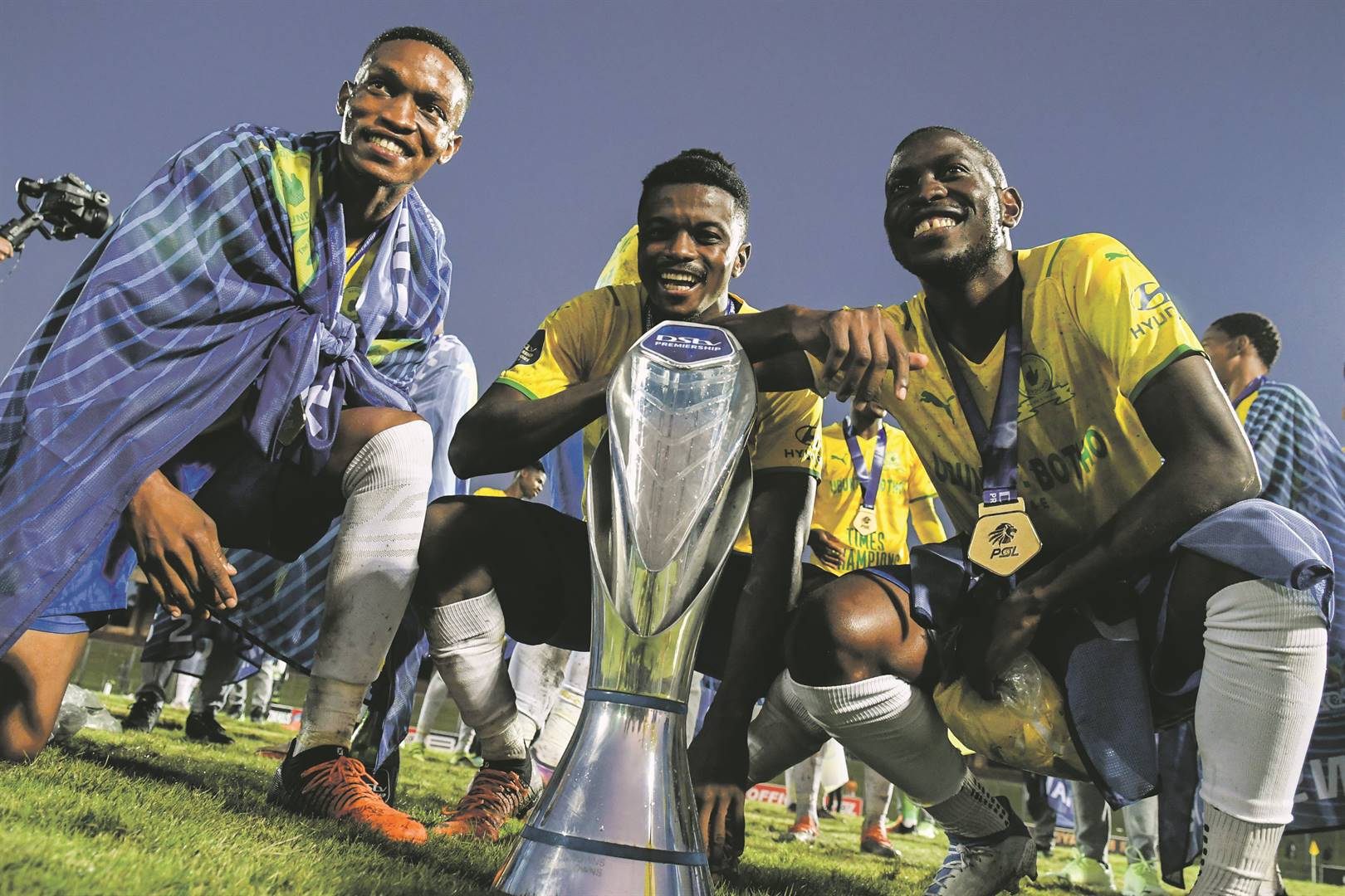 Mamelodi Sundowns players Grant Kekana, Teboho Mokoena and Aubrey Modiba with the league trophy, the club’s fifth in a row Photo: Darren Stewart / Gallo Images