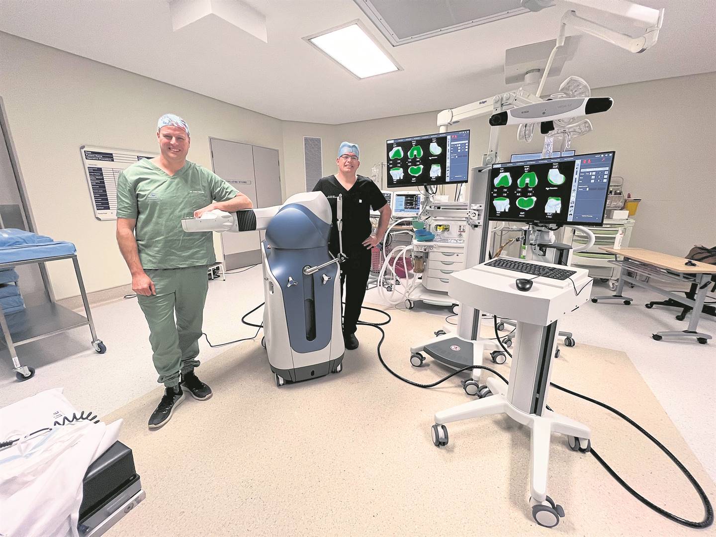 Orthopaedic surgeons, Dr James McAllister (left) and Dr Rian Smit with robot “Melissa”. The robot was used for the first time on Wednesday for knee replacement surgery at Hilton Life Hospital.