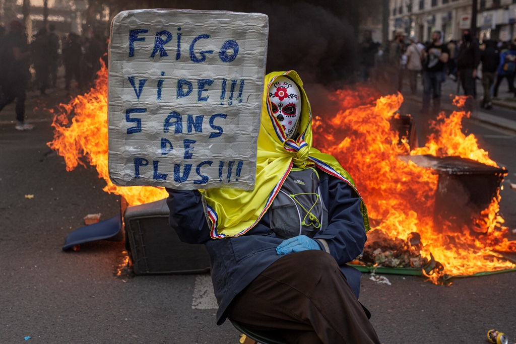 PARIS, FRANCE - MAY 01: A protester holds a banner