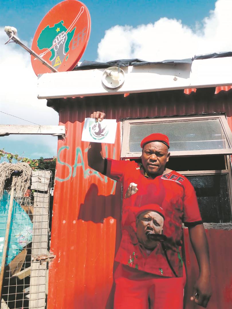 Rooi ‘Malema’ Nobatana holds a flyer of his new funeral business in front of his shack in Isiqalo.    Photo by Lulekwa Mbadamane