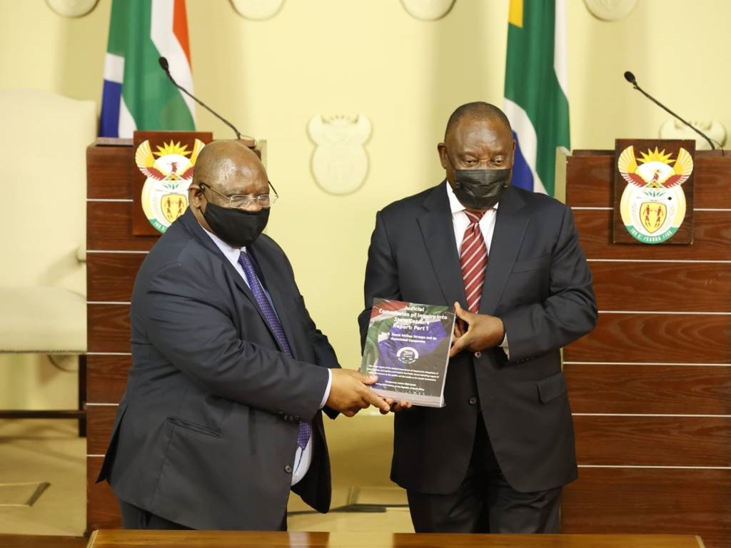 Chief Justice Raymond Zondo hands over part of the state capture report to President Cyril Ramaphosa.
