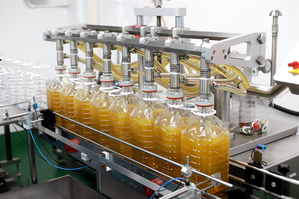 Bottling line of palm oil In bottles. (Getty Images).
