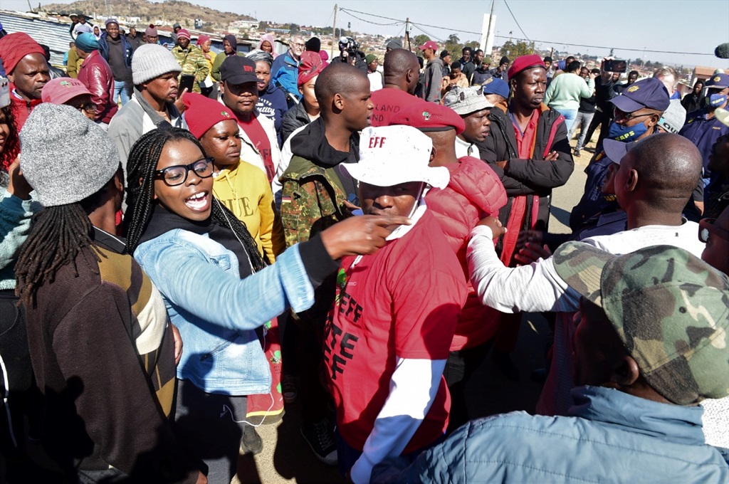 Members of EFF and Operation Dudula clash outside 