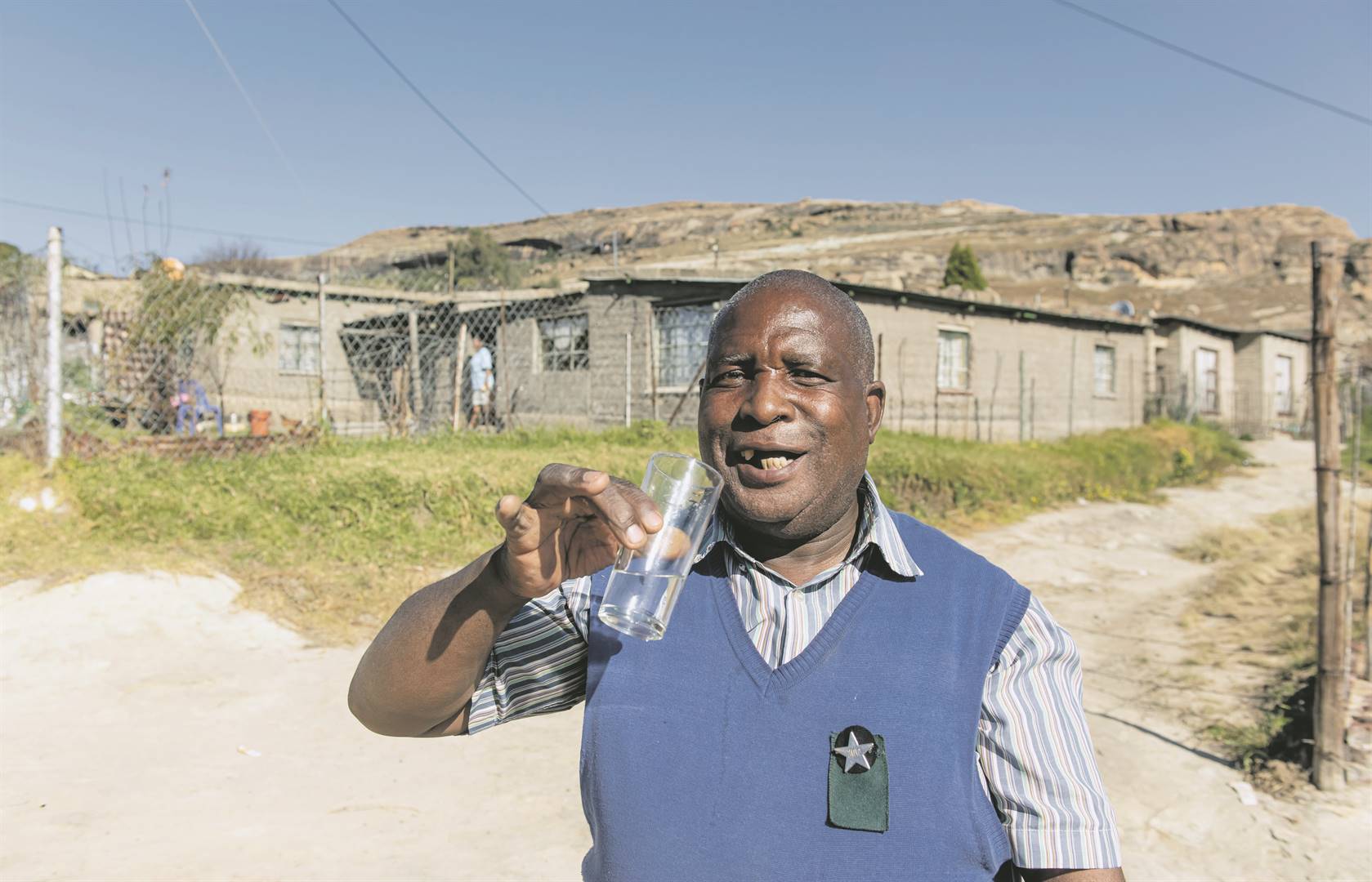 Elias Mpholo is happy to have running water in his area after years of struggle. Photo: Deon Raath