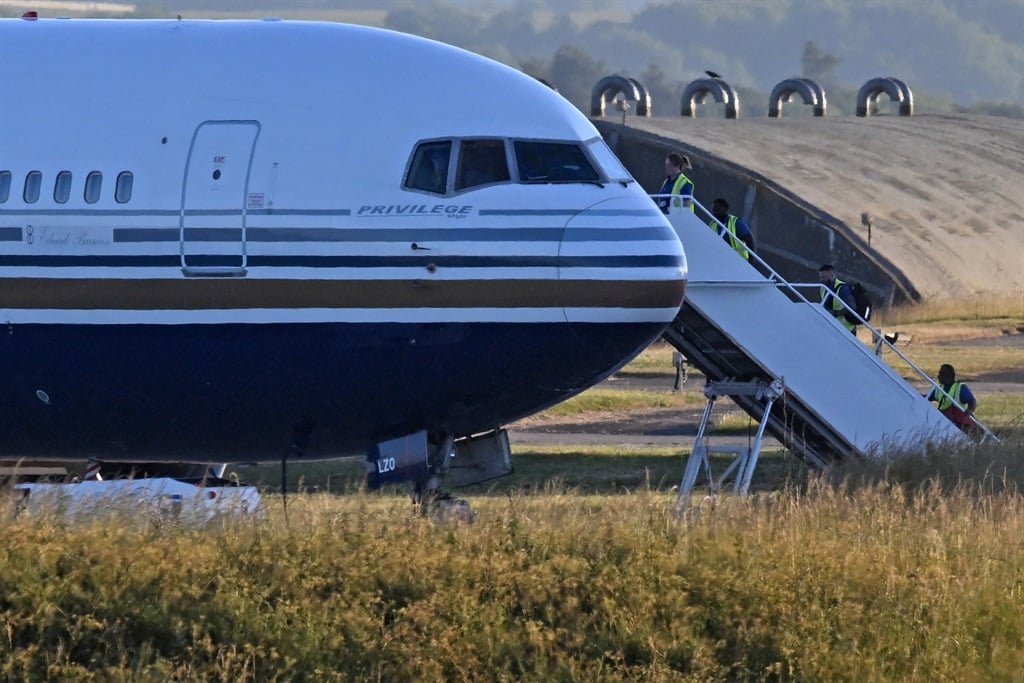A Boeing 767, meant to take a number of asylum-seekers to Rwanda, sits on the runway at the military base in Amesbury, Salisbury, on 14 June 2022.