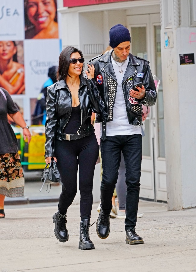  The engaged couple in matching black leather jack