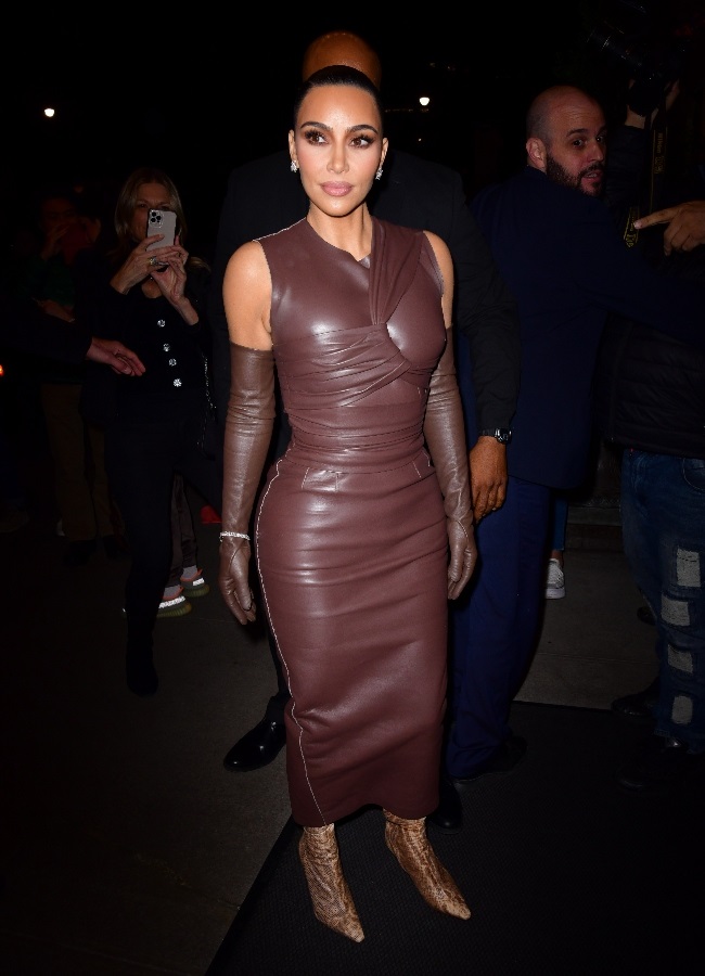 Kim says Ye compared her to cartoon character Marge Simpson when she stepped out in this dark brown latex dress.