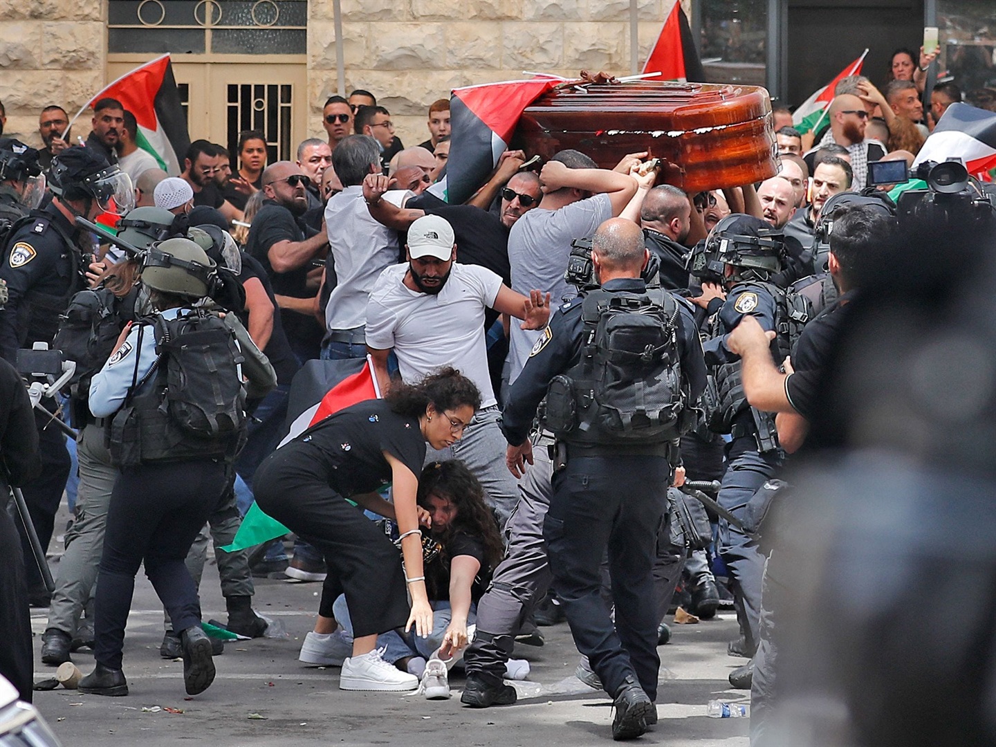 Violence erupts as Israeli security forces assault Palestinian mourners carrying the casket of slain Al Jazeera journalist Shireen Abu Akleh on Friday. Photo: Ahmad Gharabli/AFP via Getty Images