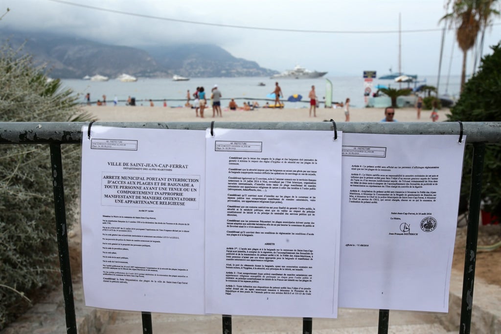 This picture taken on August 19, 2016 shows the bylaw forbidding women to wear Burkini at the main beach of Saint-Jean Cap Ferrat, southeastern France. 