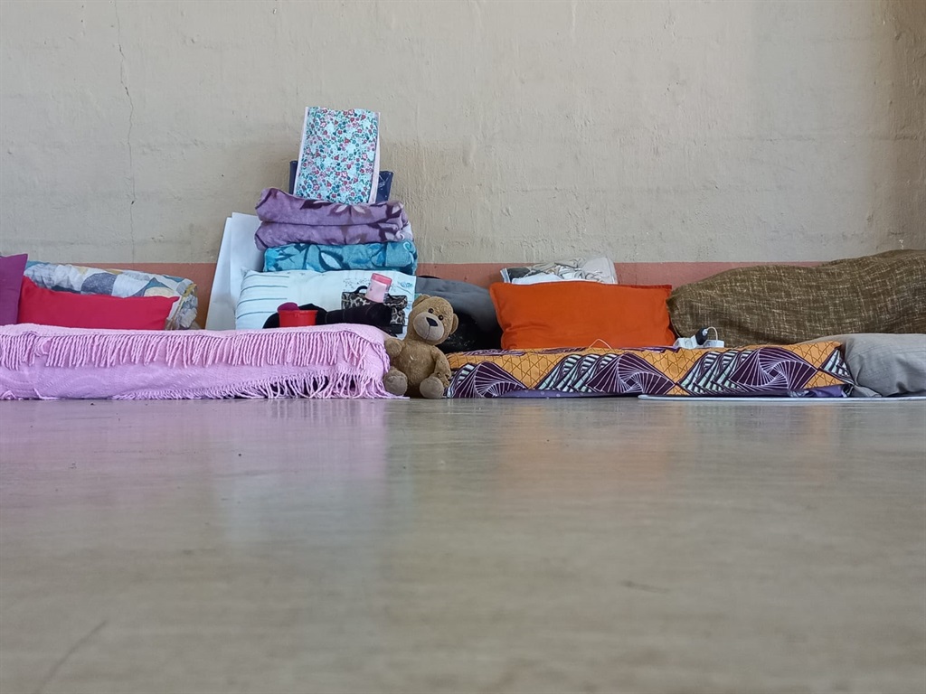 A child's teddy bear on the ground next to mattresses at the Kwa Dinabakubo Community Hall in Molweni, Durban where residents have been housed for over a month.  