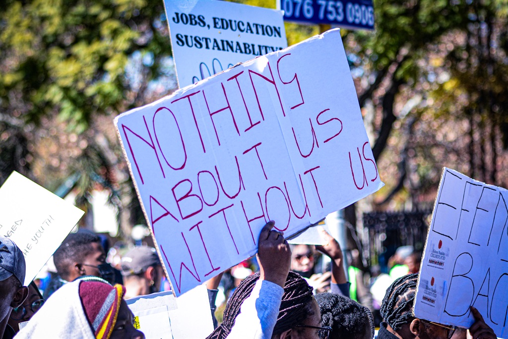 Demonstrators held posters calling for the South African  government to prioritise their futures as the youth.