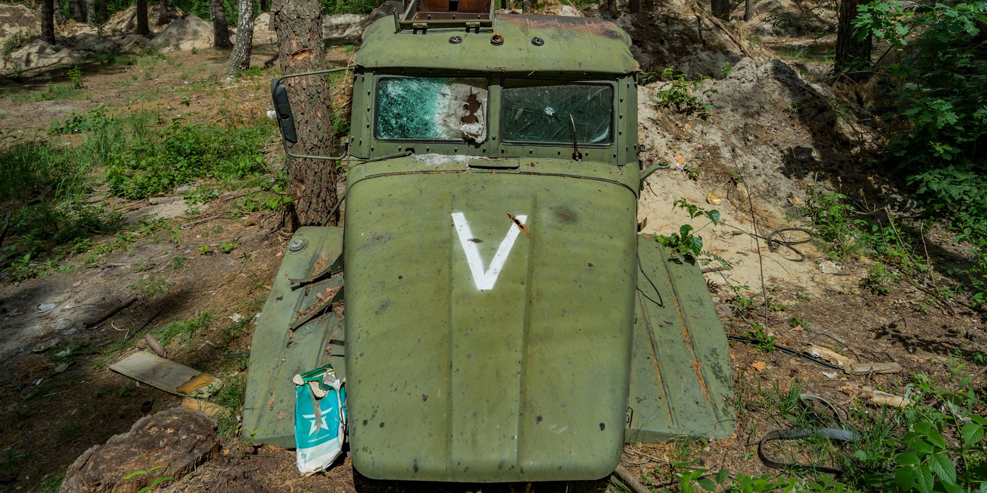 Remains of a Russian truck cabin with the V symbol in the forests around Kyiv.