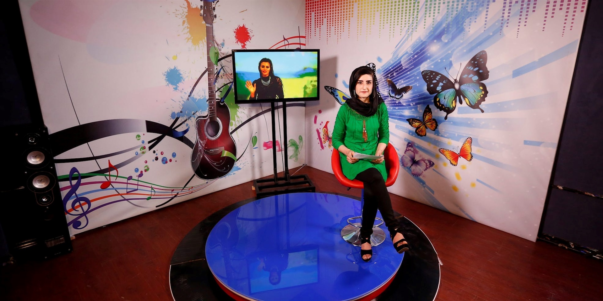 A female TV presenter records her programme at the Zan TV (women's TV) in Kabul in May 2017. REUTERS/Mohammad Ismail