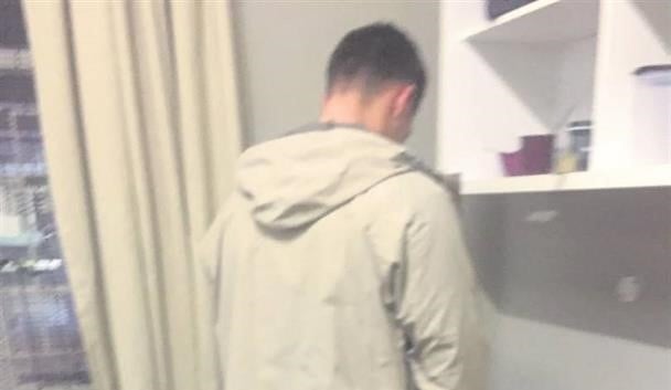A still taken from the video in which Stellenbosch University student Theuns du Toit is seen urinating on the belongings of a black student. (Screengrab)