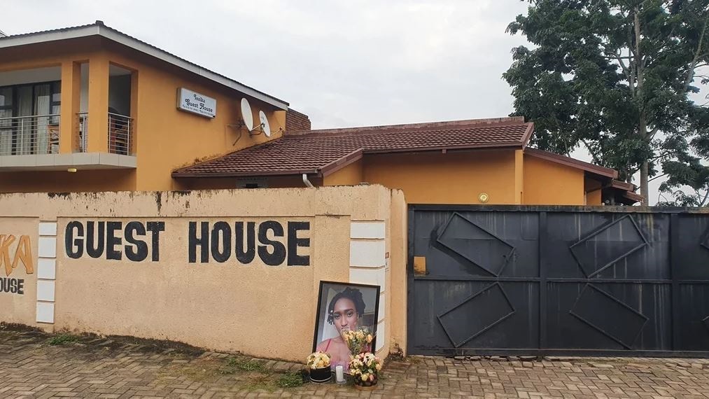 The family of Hilary Gardee laid wreaths and lit a candle outside the guest house she was allegedly murdered in to mark a week since her burial.