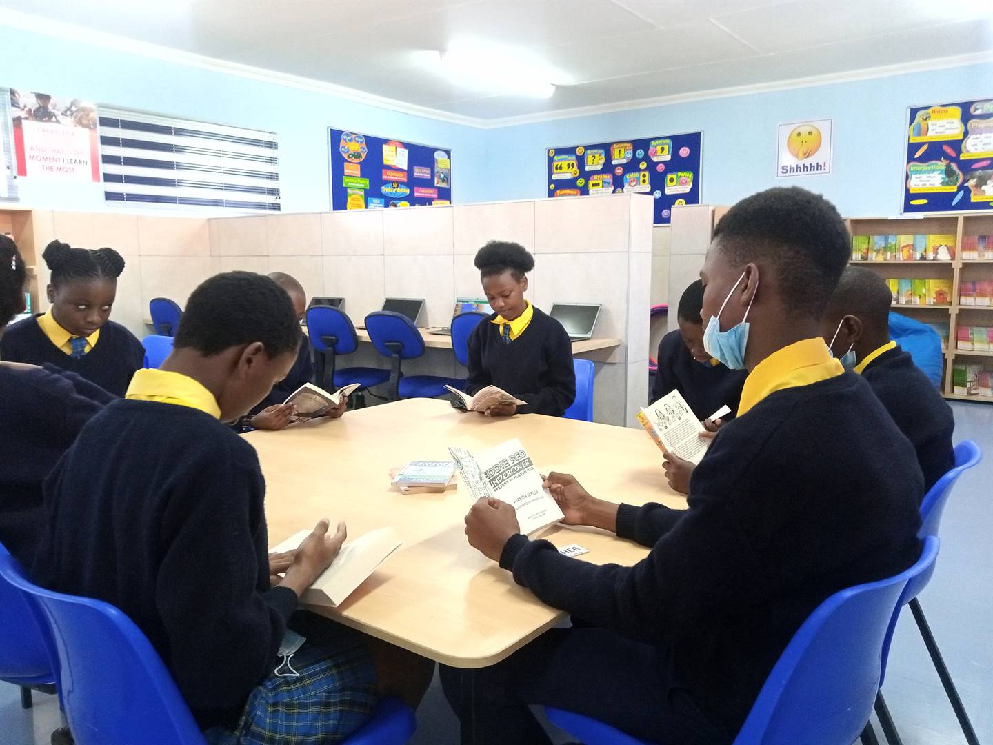 Ekuphumeleleni Primary School pupils reading books.