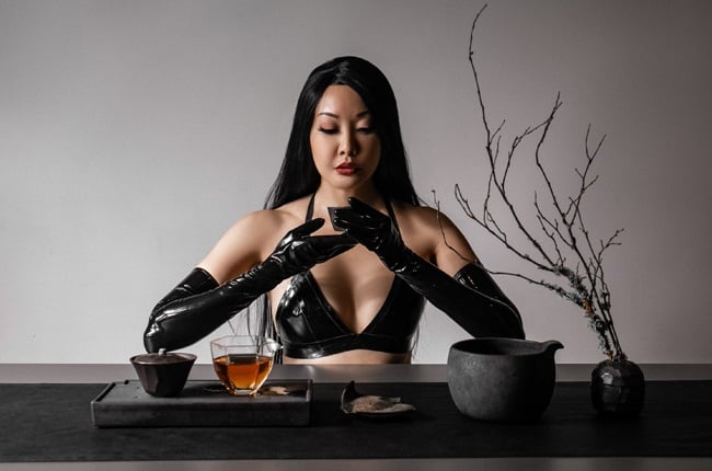 Mistress Eva sat with a tea set.