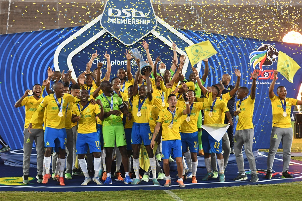 Sundowns celebrate with their DStv Premiership trophy after having officially being crowned champion at Chatsworth Stadium on Monday.