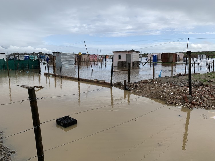 The Diep River burst its banks on Friday, flooding several homes in Zwezwe informal settlement near Milnerton, Cape Town.