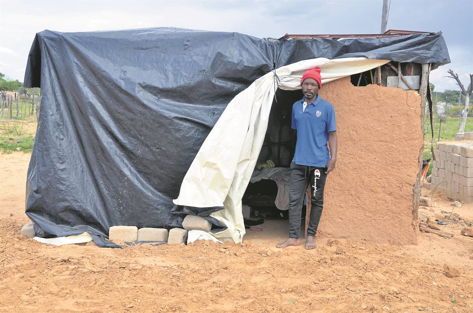 Villager Ernest Molefe said he has been living with his parents and siblings in a mud house for 10 years.                          Photo by Rapula Mancai