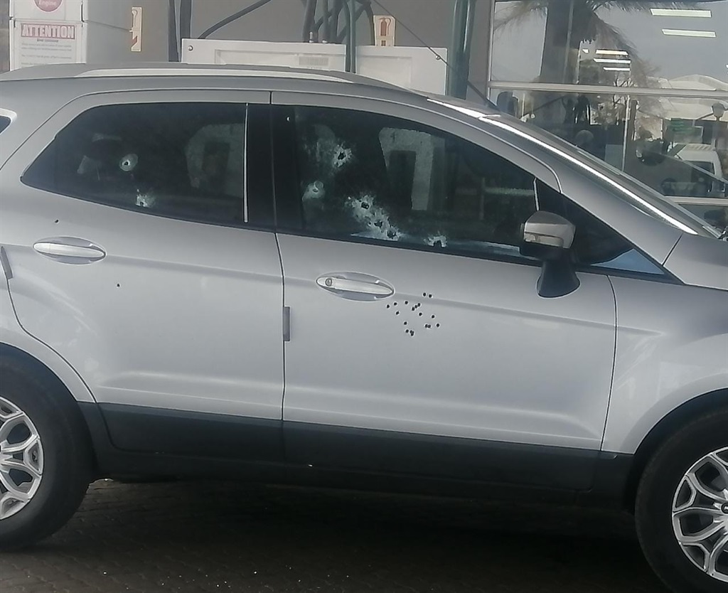 Bullet riddled vehicle seen at petrol station