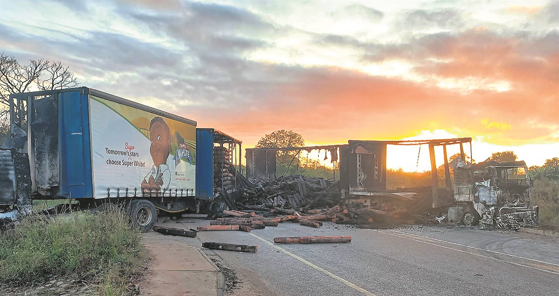 Three trucks set alight by angry residents demanding tarred roads, electricity and water.