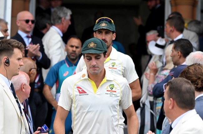 Pat Cummins and Mitchell Starc walk through the Long Room to the post match presentation after winning the second Ashes Test at Lord's Cricket Ground. (Getty Images)