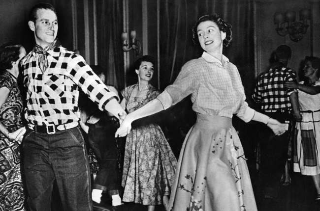 Dancing queen: Elizabeth enjoys a spot of line dancing with Prince Philip on a tour of Canada in 1952. (Gallo Images/ Alamy)