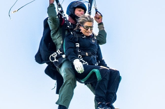 Queen Maxima prepares to land after leaping from a plane. (Photo: Magazine Features)