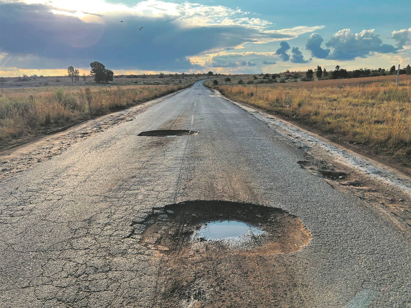 May 18.2022. Two big pothole on the road linking Welverdiend and Klerkskraal in North West province. Photo: Tebogo Letsie