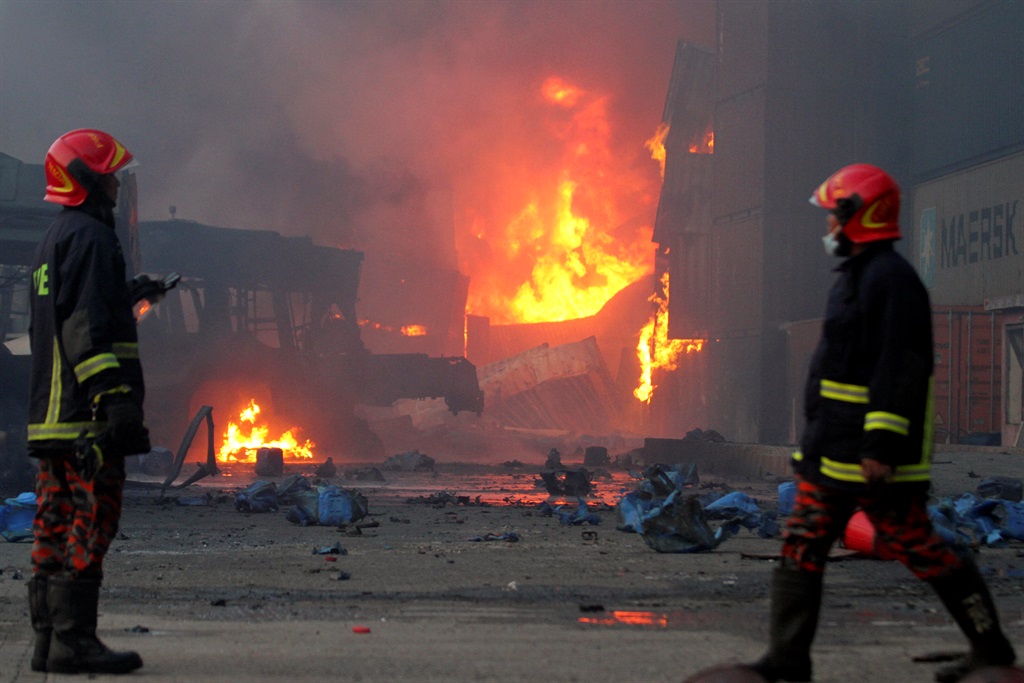 Firefighters arrive at the site after a fire broke out at a container storage facility in Sitakunda, about 40 km (25 miles) from the key port of Chittagong on June 5, 2022