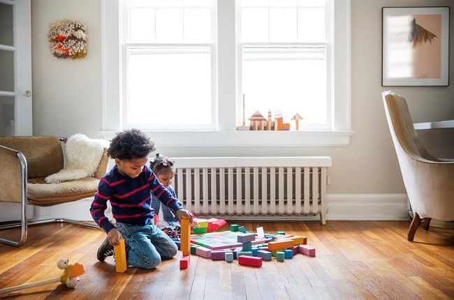 "Play with different shapes, blocks, and simple 2–3 piece puzzles with your baby to practice problem-solving skills." Photo: Getty Images.