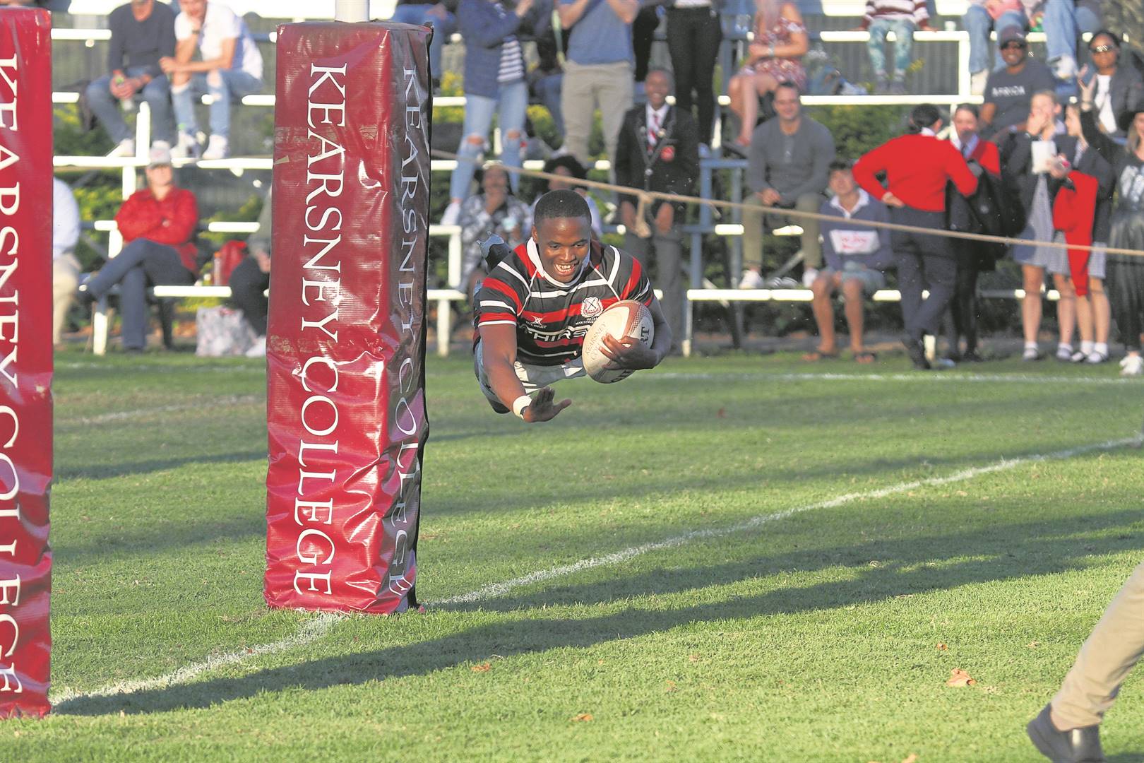 Maritzburg College’s full-back Spha Ngcobo flies across the line to score against Kearsney, which helped secure College’s 31-20 win. PHOTO: DAN BECKETT