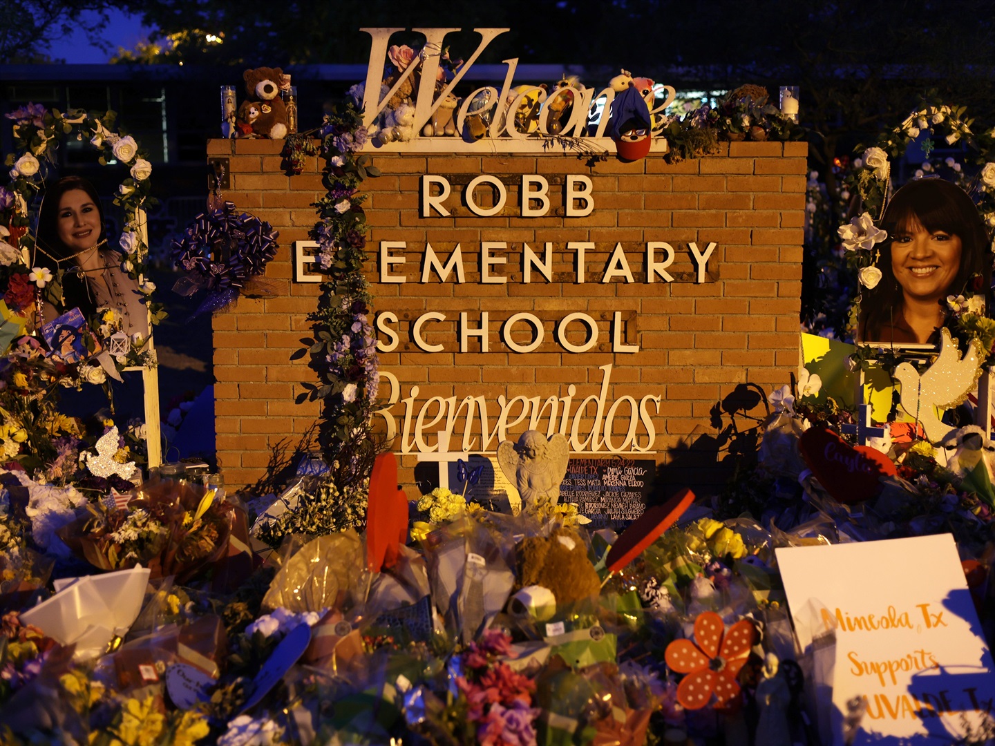 Flowers and photographs are seen at a memorial dedicated to the victims of the mass shooting at Robb Elementary School on June 3, 2022 in Uvalde, Texas. Photo by Alex Wong/Getty Images
