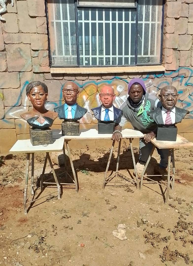 Artist Patrice Mabasa with some of the sculptures he has crafted of President Cyril Ramaphosa (from right), Limpopo Premier Stan Mathabatha, Arts and Culture MEC Thandi Moraka and Arts and Culture MEC Nathi Mthethwa. Photo by Judas SekwelaPhoto by 