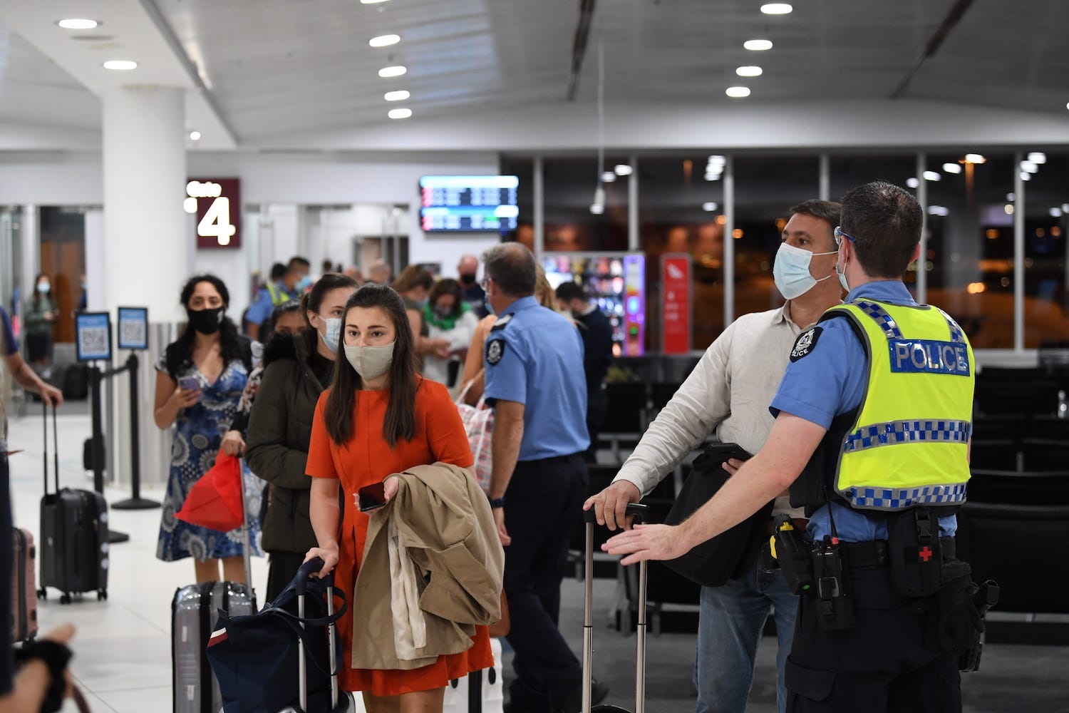 Volunteers may be asked to assist passengers with lost baggage and ferry people through security. James D. Morgan / Contributor/ Getty Images