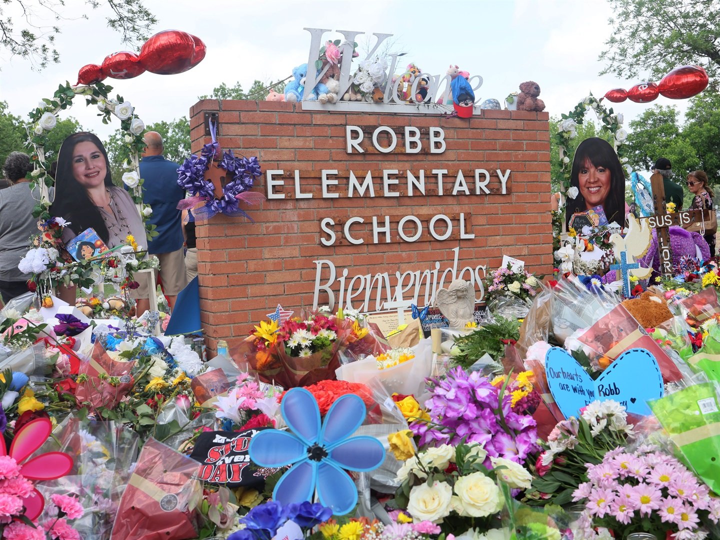 People visit a memorial for the 19 children and two adults killed on May 24th during a mass shooting at Robb Elementary School on May 30, 2022 in Uvalde, Texas. Michael M. Santiago/Getty Images