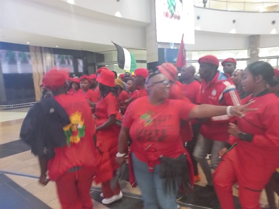 EFF members already getting their voices ready for Bafana Bafana's arrival at the OR Tambo International Airport