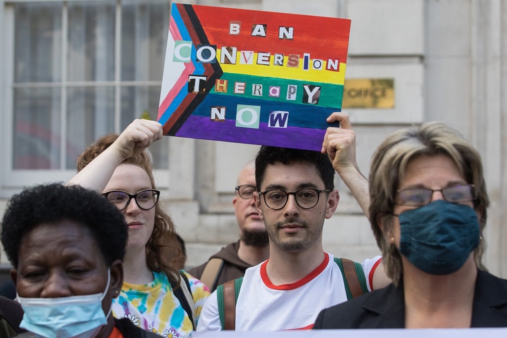Campaigners against LGBT+ conversion therapy attend a picket on 23 June 2021 in London. (Photo by Mark Kerrison/In Pictures via Getty Images)