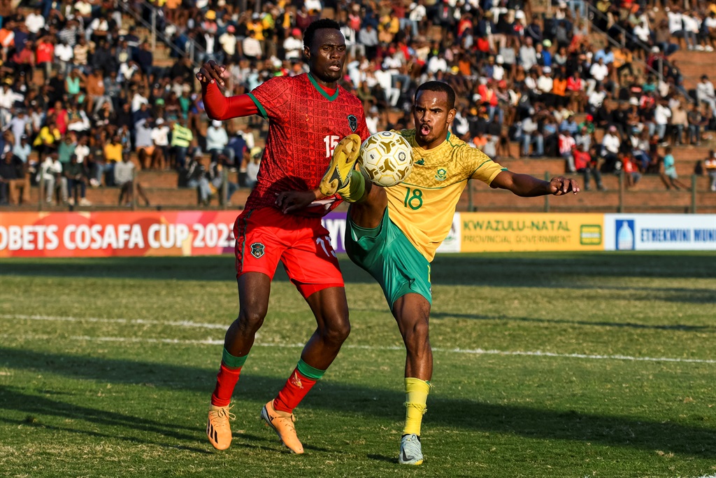 DURBAN, SOUTH AFRICA - JULY 16: Iqraam Rayners of South Africa and Lawrence Chaziya of Malawi during the 2023 COSAFA Cup, 3rd place play-off match between Malawi and South Africa at King Zwelithini Stadium on July 16, 2023 in Durban, South Africa. (Photo by Darren Stewart/Gallo Images)