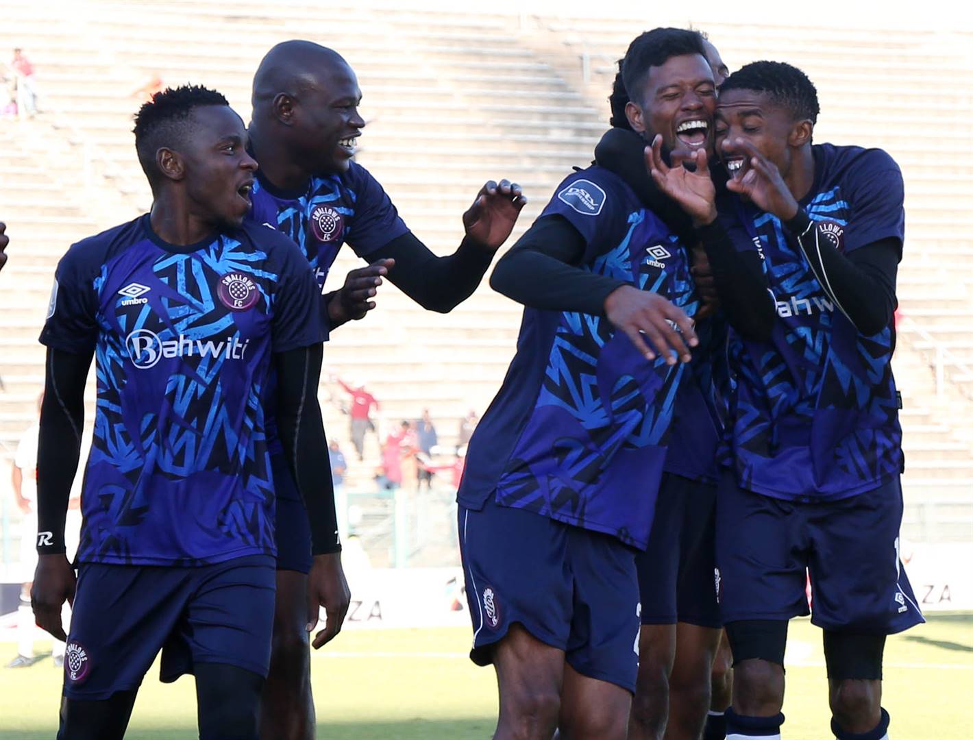 Swallows players celebrate with goal-scorer Yagan Sasman during the team’s win over AmaTuks in their PSL promotion play-off at Lucas Moripe Stadium. Photo: Samuel Shivambu/BackpagePix